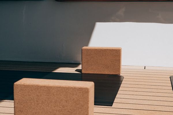 Minimalist wooden yoga blocks and a mat layout